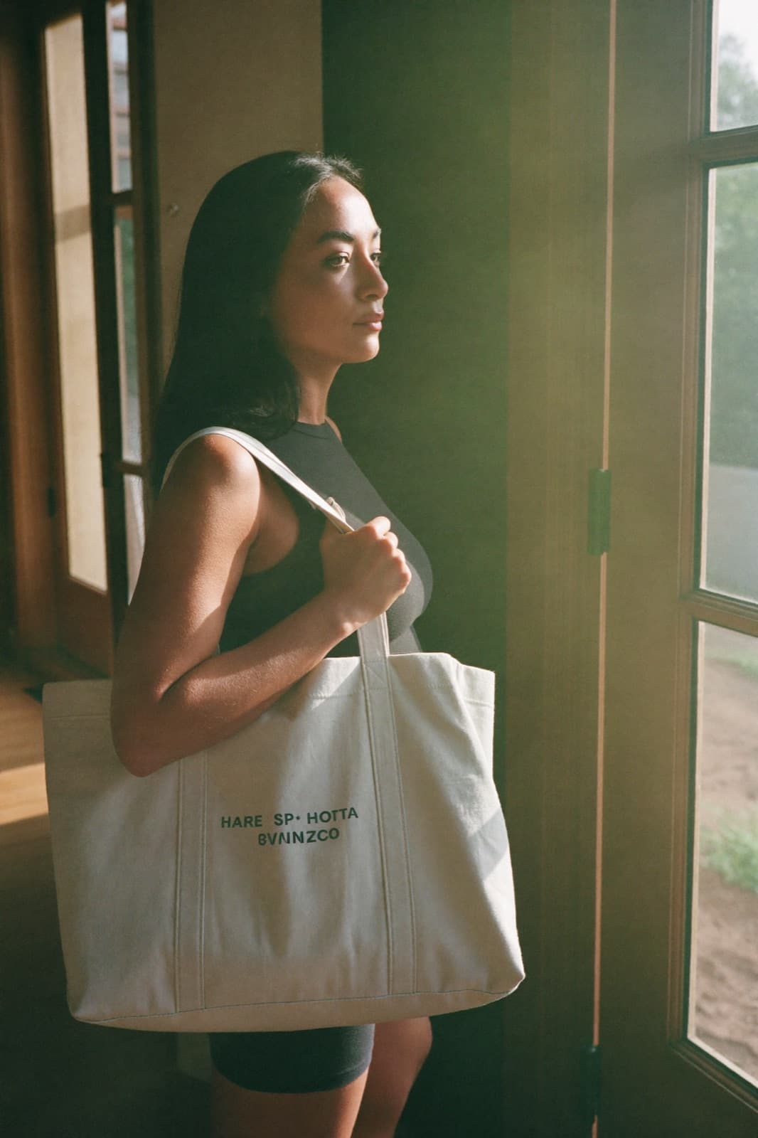 A woman leaving home with her gym bag